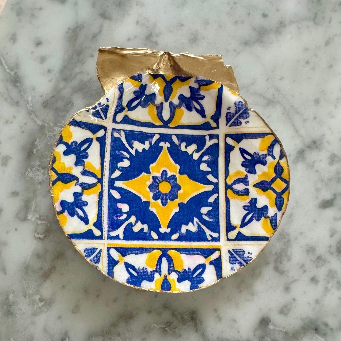 Detailed view of blue & yellow mediterranean tile shell trinket dish