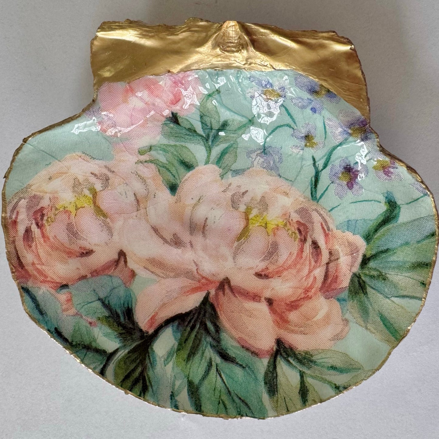 Detailed view of vintage pink botanical shell trinket dish
