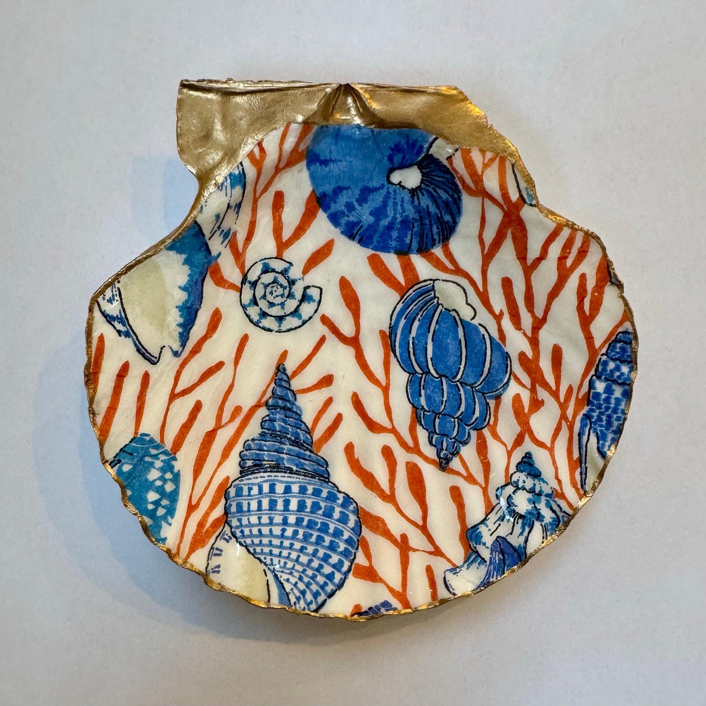 Blue and orange coastal shell ring dish with coral design