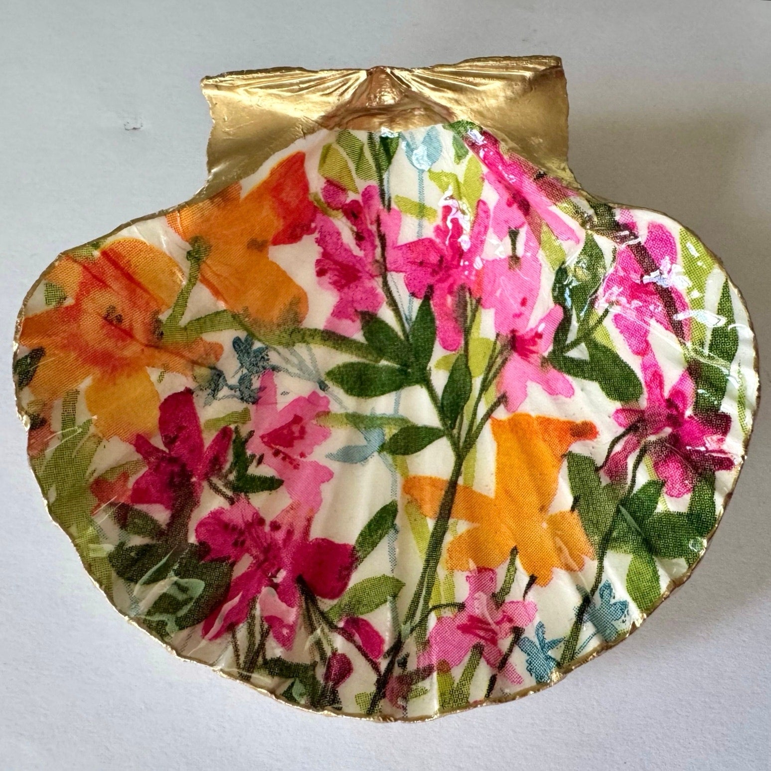 Detailed view of bright wildflower shell trinket dish