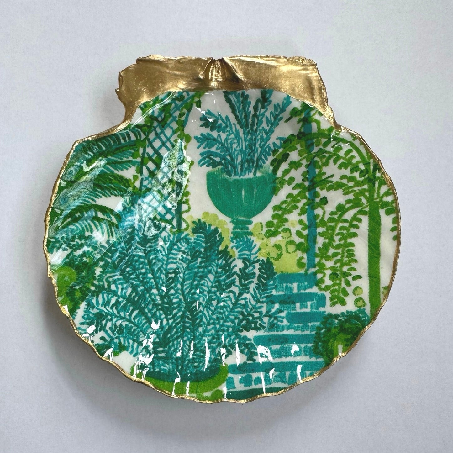 Detailed view of green fern botanical shell trinket dish