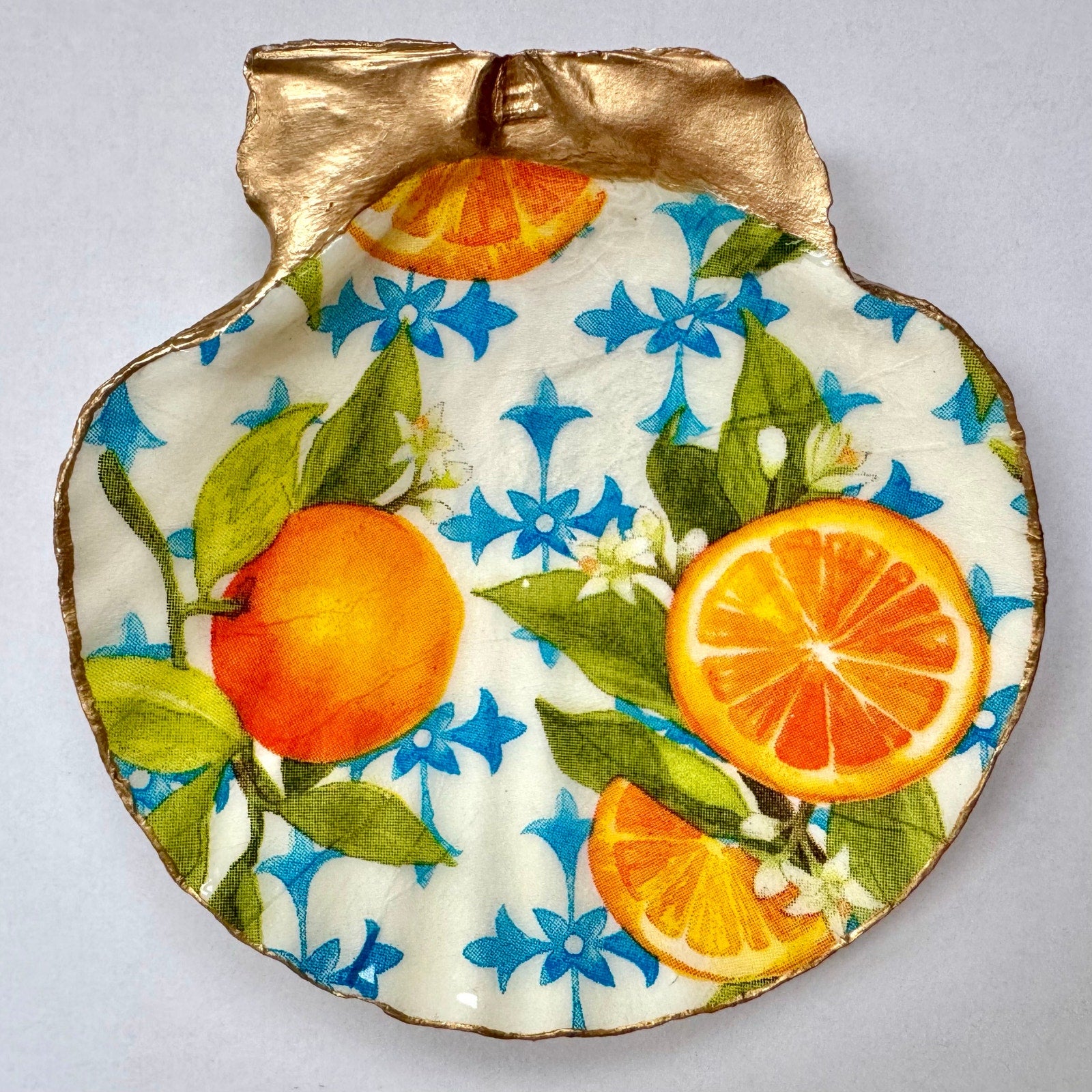 Detailed view of citrus & blue floral shell trinket dish
